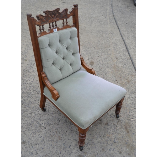 152 - Edwardian button back armchair with carved details