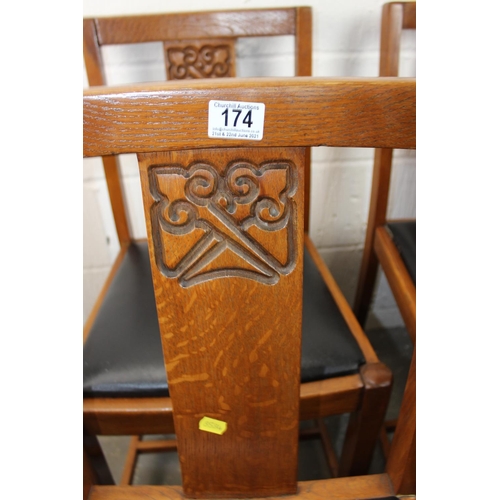 174 - A set of 4 early 20th century oak dining chairs with carved details