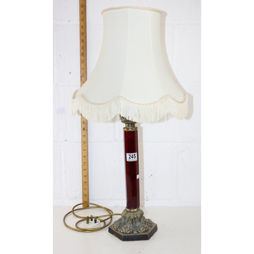 245 - An impressive brass and ruby glass table lamp converted from an oil lamp