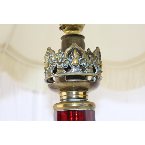 245 - An impressive brass and ruby glass table lamp converted from an oil lamp