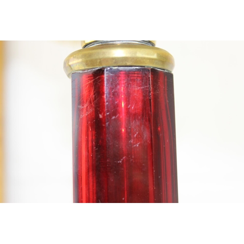 245 - An impressive brass and ruby glass table lamp converted from an oil lamp