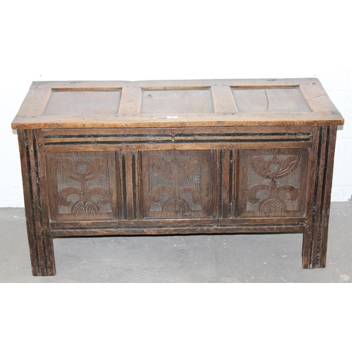 41 - An antique oak coffer with carved details