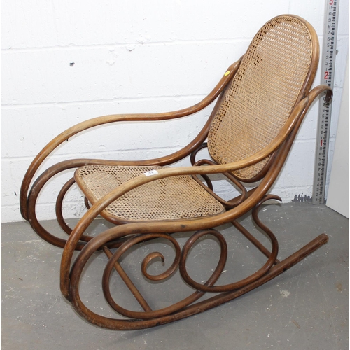 42 - An early 20th century bentwood rocking chair with Bergere seat in the manner of Thonet