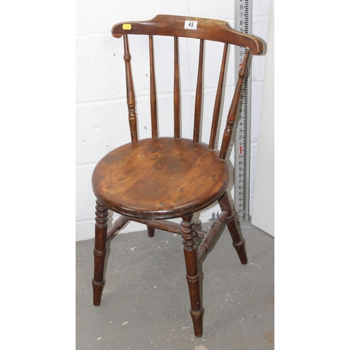 43 - An antique stickback armchair with round seat