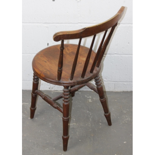 43 - An antique stickback armchair with round seat