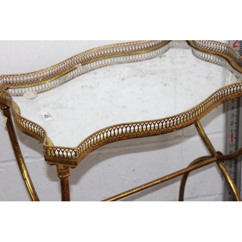 46 - A vintage style gilt metal table with mirror glass top