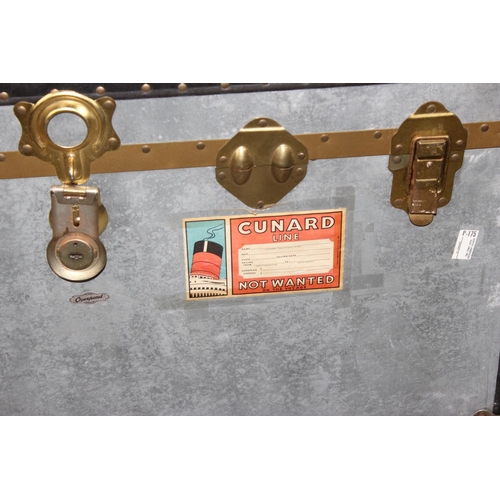 54 - 2 vintage aluminium trunks, one with Cunard label