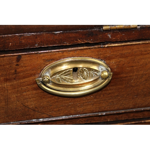 62 - A Georgian Oak bureau standing on bracket feet with brass handles