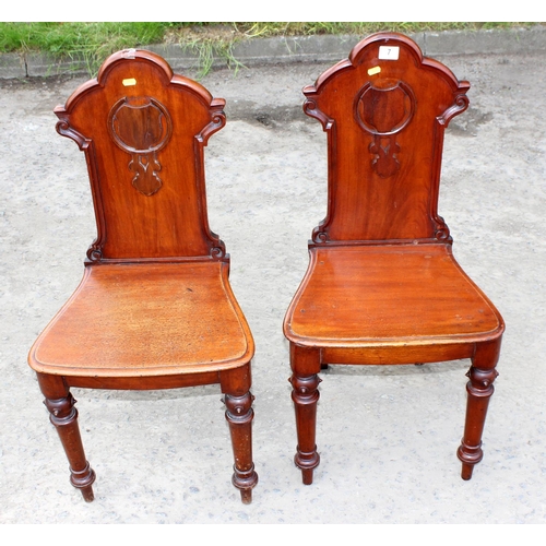 7 - A pair of 19th century Gothic style mahogany hall chairs