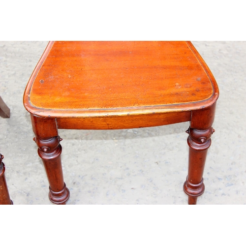 7 - A pair of 19th century Gothic style mahogany hall chairs