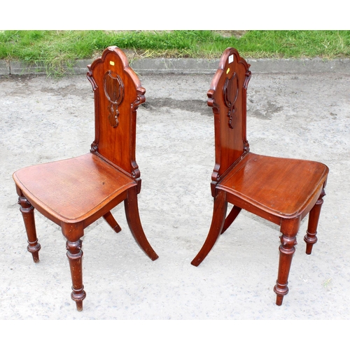 7 - A pair of 19th century Gothic style mahogany hall chairs