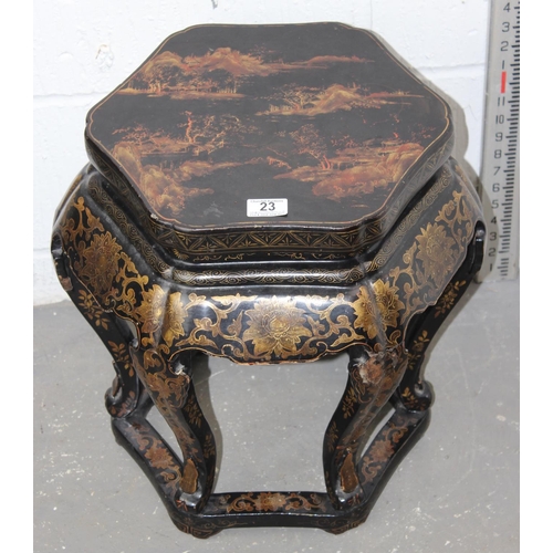 23 - An early 20th century Oriental black lacquer jardiniere stand with painted decoration