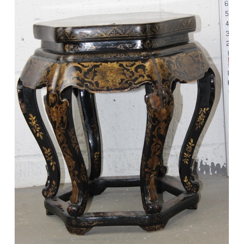 23 - An early 20th century Oriental black lacquer jardiniere stand with painted decoration