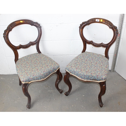 26 - A pair of Victorian Balloon backed dining chairs with carved details