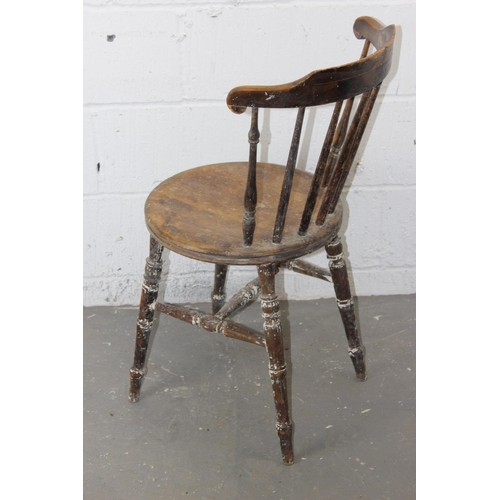 27 - An antique stick back chair with round seat