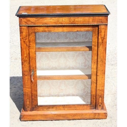 83 - A Victorian display cabinet with marquetry inlay and original key