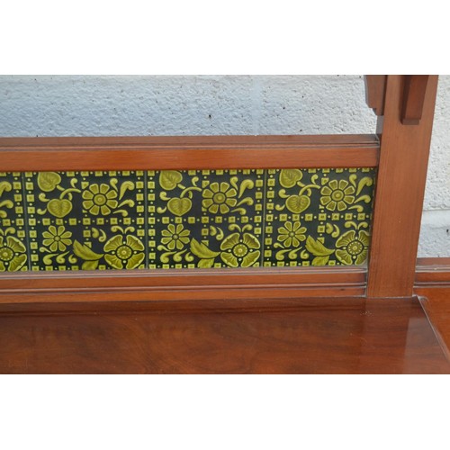 129 - An extremely large late Victorian mahogany hall stand set with Art Nouveau tiles and an elongated oc... 