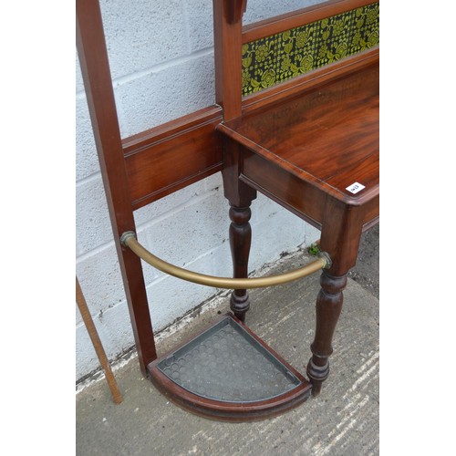 129 - An extremely large late Victorian mahogany hall stand set with Art Nouveau tiles and an elongated oc... 