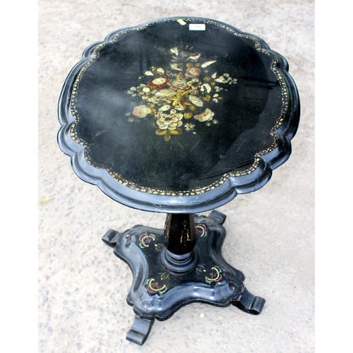 10 - An unusual antique tilt top table made from Papier Mache and ebonised wood with painted floral detai... 