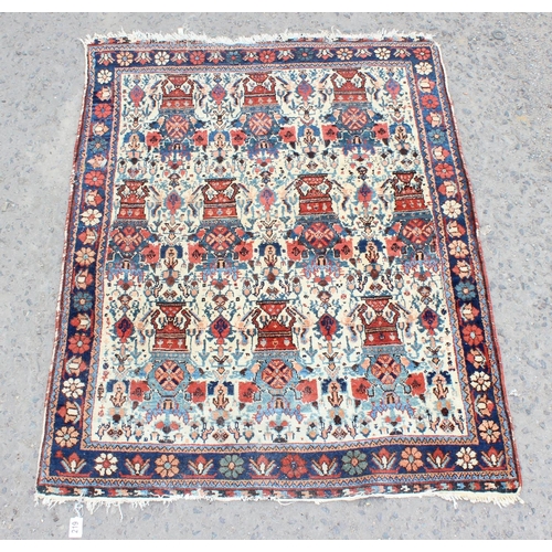 219 - An unusual antique rug with floral border
