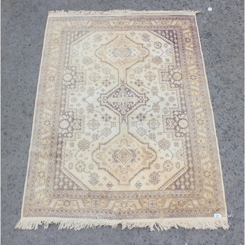 220 - A modern cream ground rug with 3 medallions