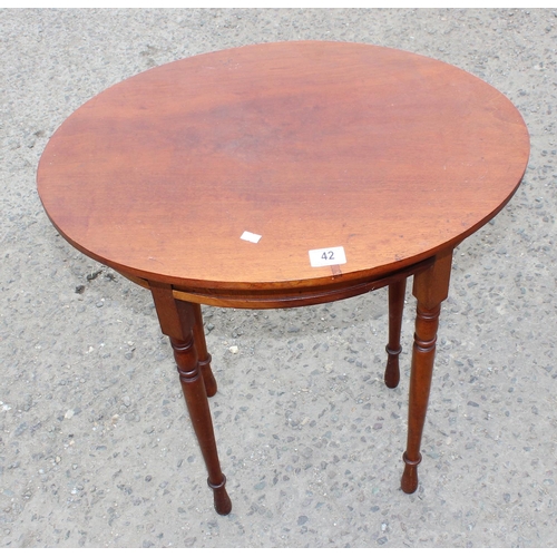 42 - A small oval Mahogany side table