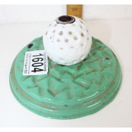 1604 - An Art Deco period enamelled cast iron pen holder formed as a golf ball