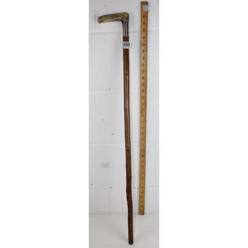 1609 - A silver and antler handled walking stick, hallmarks obscured but London c.1900