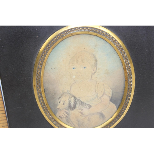 320 - A 19th century pencil and wash portrait miniature of a girl with her dog, in original frame