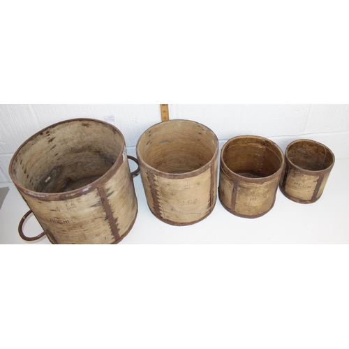 600 - A set of 4 early/ mid 20th century wooden and iron grain measures - Bushel - Quarter Peck