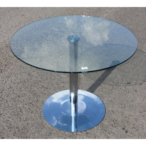 11 - Glass topped round table with polished metal base