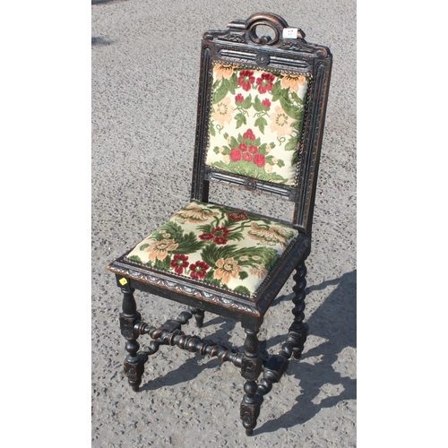 17 - Antique Jacobean style oak chair with stuffed seat