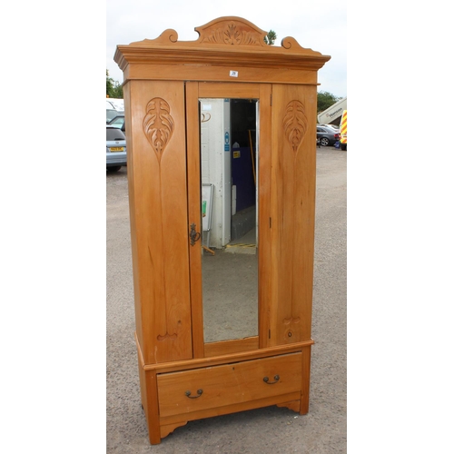 29 - Pine wardrobe with mirror door, drawer & carved details