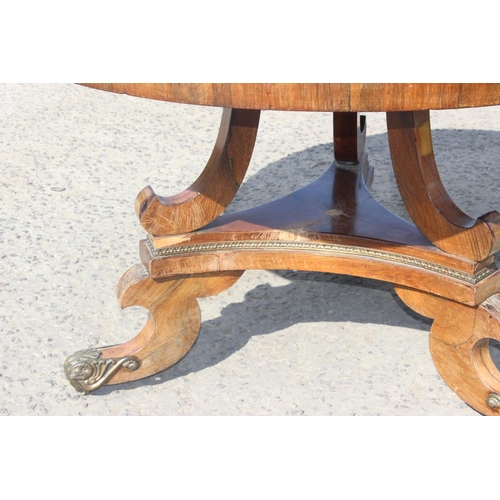 3 - A 19th century Rosewood folding breakfast table with gilt metal mounts to base