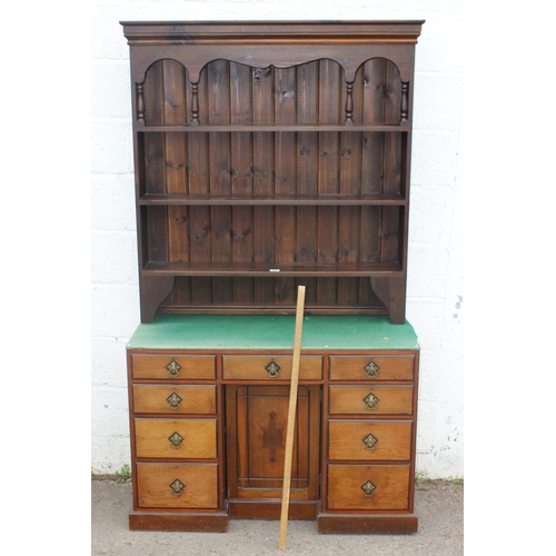 36 - An antique desk with Gothic style handles and carving with dresser top