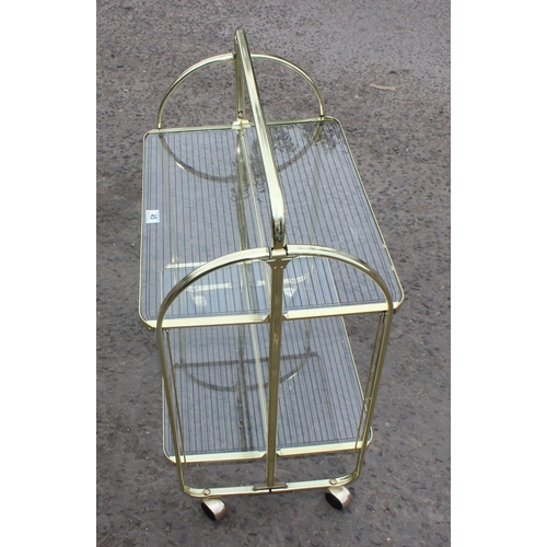 45 - A retro folding glass and gold finished serving trolley