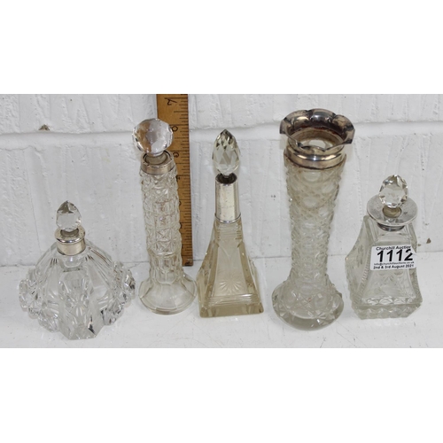 1112 - 5 silver topped and cut glass bottles of various designs