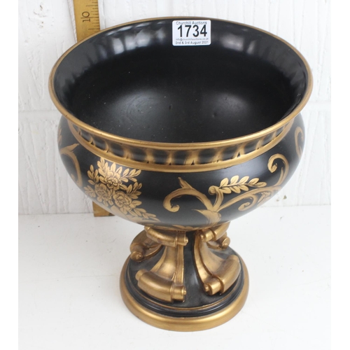 1734 - A large black and gilt decorative vase or urn in the classical style