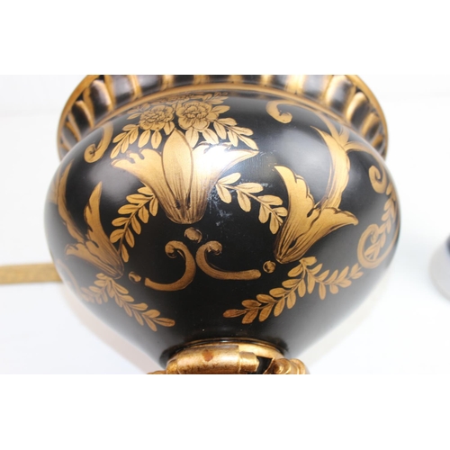 1734 - A large black and gilt decorative vase or urn in the classical style