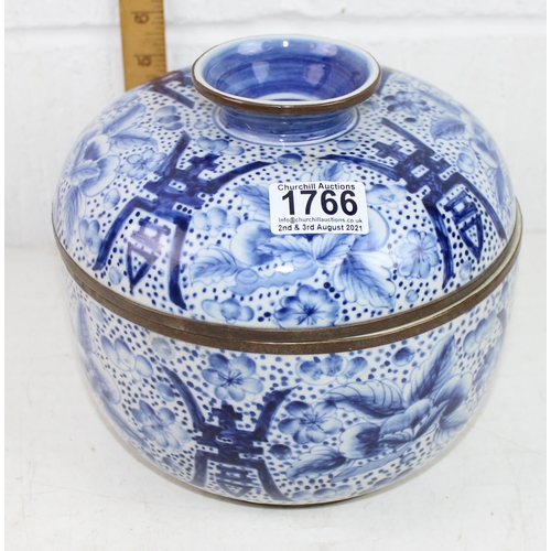 1766 - A Chinese blue and white crackle glaze lidded pot with copped rim, marked verso