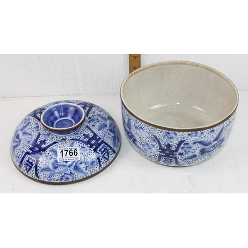 1766 - A Chinese blue and white crackle glaze lidded pot with copped rim, marked verso