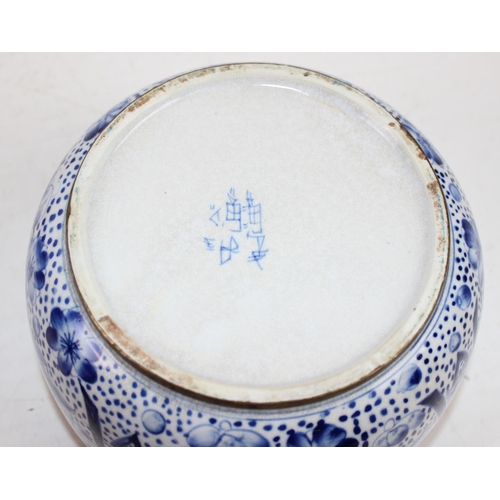 1766 - A Chinese blue and white crackle glaze lidded pot with copped rim, marked verso