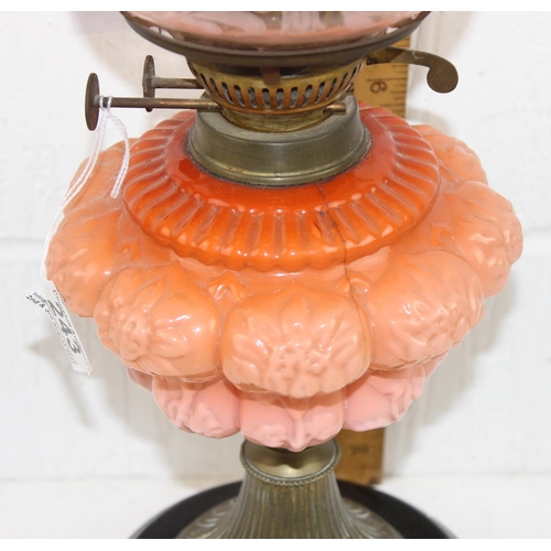 243 - An impressive antique oil lamps with graduated coral coloured reservoir, Eltex burner and etched gla... 