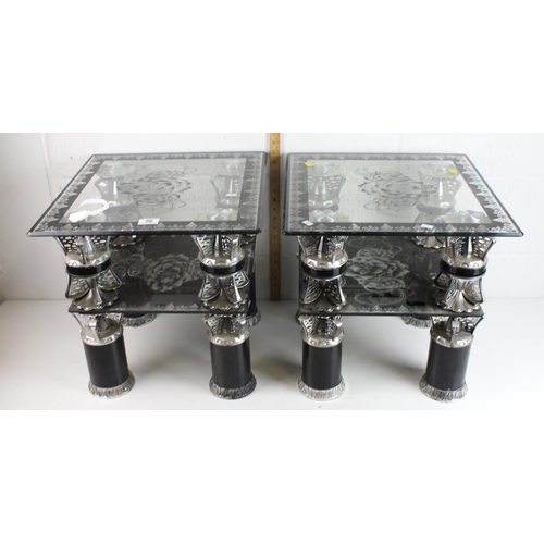 56 - A pair of chrome and black decorative tables with glass tops