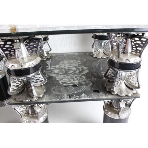 56 - A pair of chrome and black decorative tables with glass tops