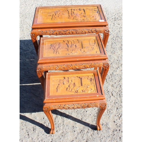 59 - A nest of carved wooden Chinese tables