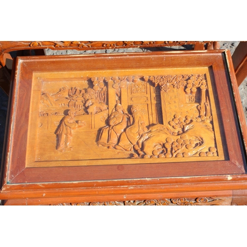 59 - A nest of carved wooden Chinese tables