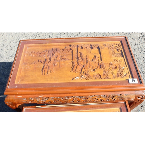 59 - A nest of carved wooden Chinese tables