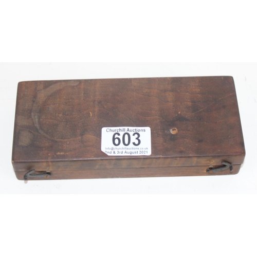 603 - A wooden boxed set of scientific weights and a pair of balance scales