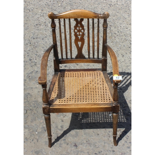 62 - Vintage child's wheel back armchair with cane seat